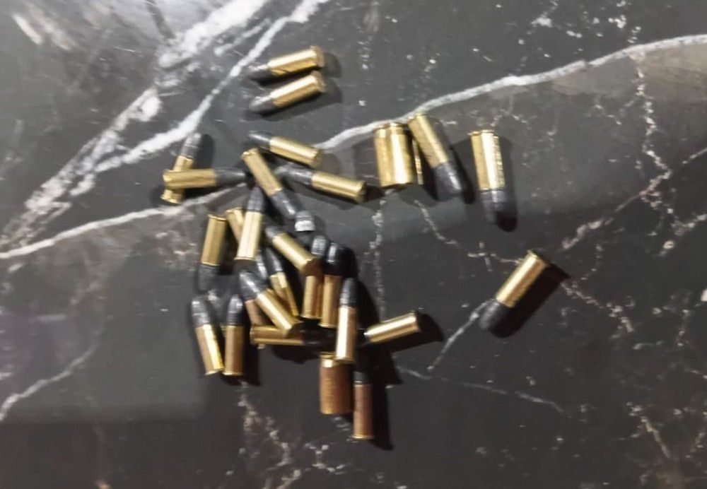 Munição encontrada na casa de um dos investigados — Foto: Divugação/SSPTO